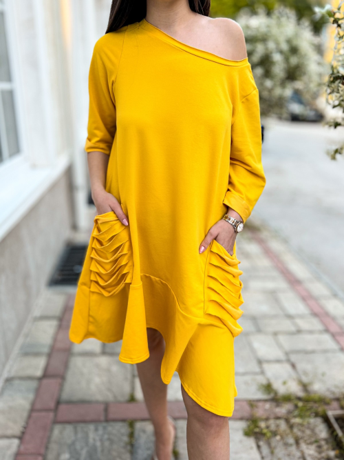 Sun of Dubai Women's Dress in Yellow  https://www.toromoda.com/products/womans-dubai-dress  Beautiful women's dress with asymmetric length, spectacular neckline with dropped shoulder, frill on the hem.Freestyle cut, beautiful deep yellow color