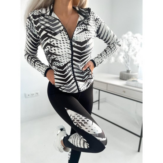 Sports set jacket and leggings Monochrome  https://www.toromoda.com/products/womans-sports-set-jacket-and-leggings-1  High-waisted leggings and zip-up jacket, two active pockets.Material: polyamide, elastaneThe model is wearing a size S.