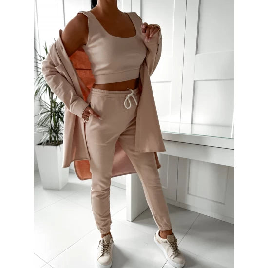 Three pieces set Comfy and Sexy in beige  https://www.toromoda.com/products/womens-three-pieces-set-comfy-and-sexy-in-beige  Three pieces set of a long shirt type top with buttons and pockets, sweatpants with an elasticated waist and cuffs and two active pockets and a crop top.
