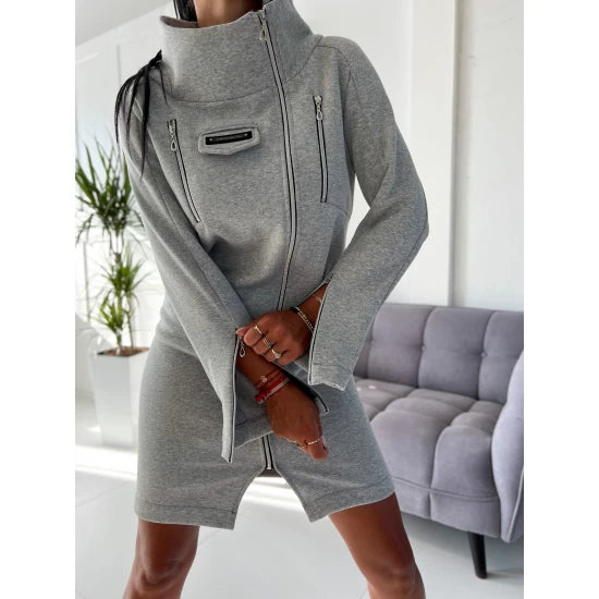 Women's Cozy Zip Up Sweatshirt Dress  https://www.toromoda.com/products/womens-cozy-zip-up-sweatshirt-dress  A beautiful sweater-dress model made of soft, slightly quilted cotton fabric. Zip fastening, high collar, active sleeve zips, active flap pocket. Fabric: