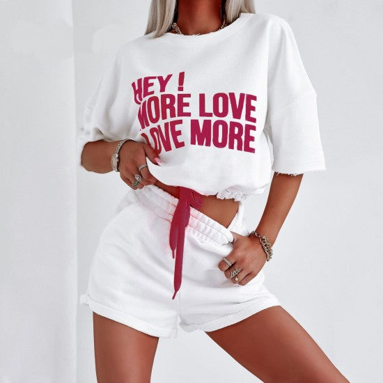 Set with shorts LOVE MORE in white  https://www.toromoda.com/products/women-s-set-with-shorts-love-more-in-white  Summer set of a cropped sweatshirt with active ties at the waist and an open neckline and shorts with pockets and an elasticated waist.
