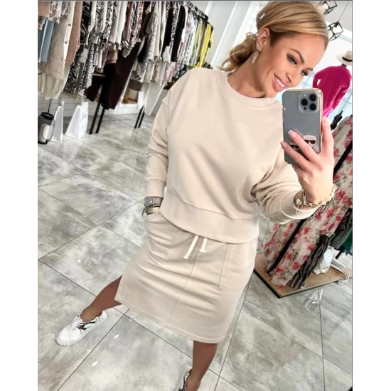 Ladies set Lara in beige by ToroModa  https://www.toromoda.com/products/womens-set-lara-in-beige  A wonderful set of a long-sleeved sweatshirt and a knee-length skirt with a slit and pockets. Elastic band and active waist ties.