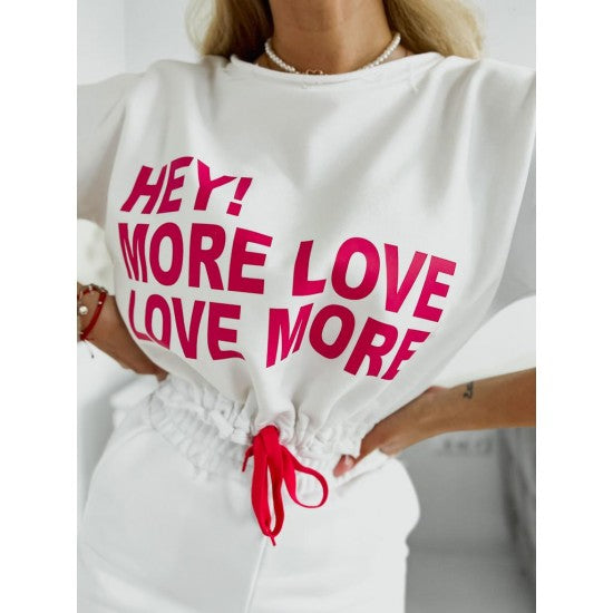 Set with shorts LOVE MORE in white  https://www.toromoda.com/products/women-s-set-with-shorts-love-more-in-white  Summer set of a cropped sweatshirt with active ties at the waist and an open neckline and shorts with pockets and an elasticated waist.