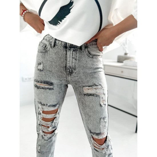 Womans Ripped Fit Gray Denim Jeans  https://www.toromoda.com/products/womans-ripped-fit-denim-jeans  Introducing our latest addition Denim Jeans. These jeans are a perfect blend of style comfort and versatility designed to elevate your wardrobe to new heights