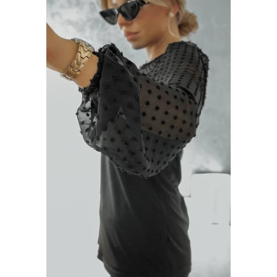 Formal black blouse with tulle sleeves  https://www.toromoda.com/products/womens-black-blouse-with-tulle-sleeves  Elegant women's blouse with a delicate tulle with embroidery. Mid length, fitted cut, button fastening at back.