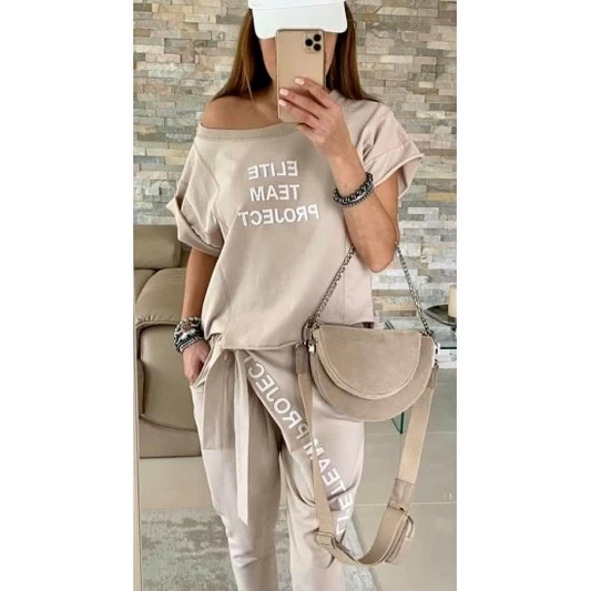 Ladies set Elite Teams in beige by ToroModa  https://www.toromoda.com/products/ladies-set-elite-teams-in-beige  Women's Two Piece Set:t-shirt with asymmetric hem and outer decorative patchfly and tie pants, two side pockets, elastic waist, free hem without cuff.