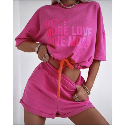 Set with shorts LOVE MORE in cyclamen  https://www.toromoda.com/products/set-with-shorts-love-more-in-cyclamen  Summer set of a cropped sweatshirt with active ties at the waist and an open neckline and shorts with pockets and an elasticated waist.