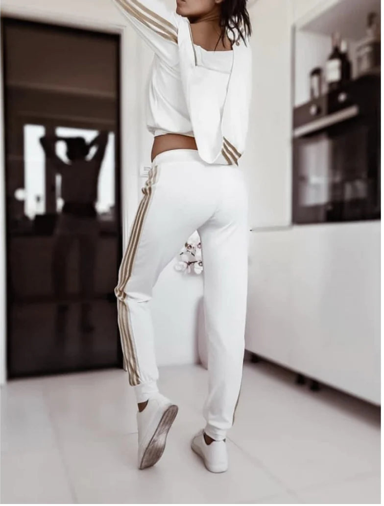Woman's Mickey Mouse Workout Set  https://www.toromoda.com/products/womans-mickey-mouse-workout-set  Cool sports outfit with gold piping and zippers on the top. Pants with elastic waist and active ties, cuffs, side pockets. Material: Polyamide Origin: Bulgaria